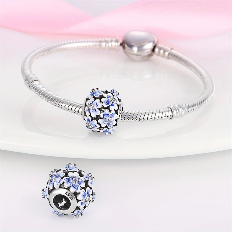 Sterling Silver Blue Travel Flower Charm - Enchanting Charms